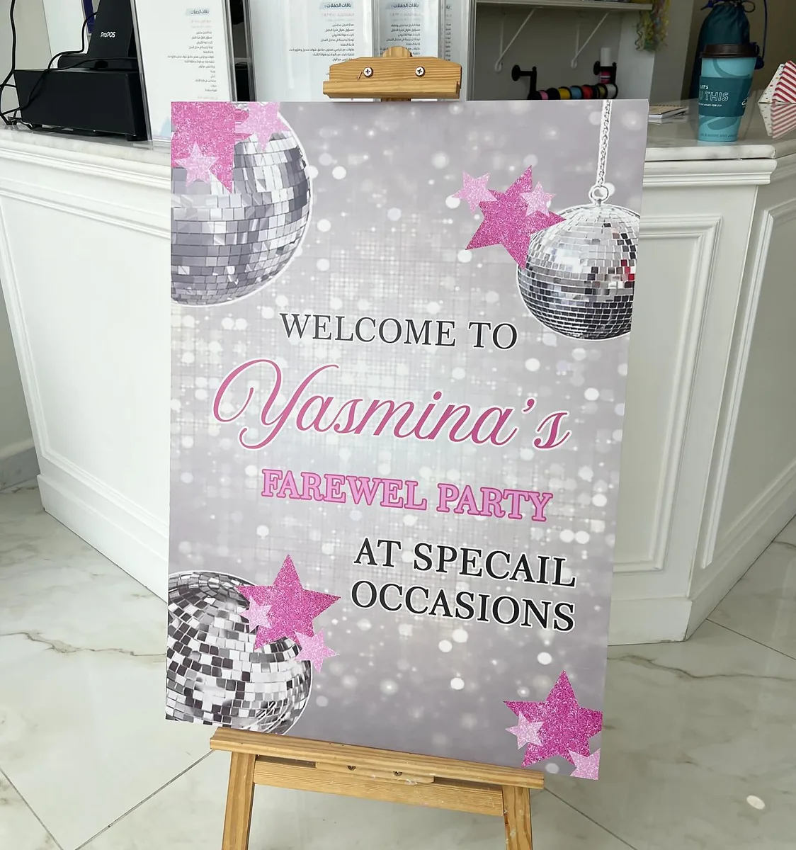 Disco-themed farewell party welcome sign displayed on a wooden easel