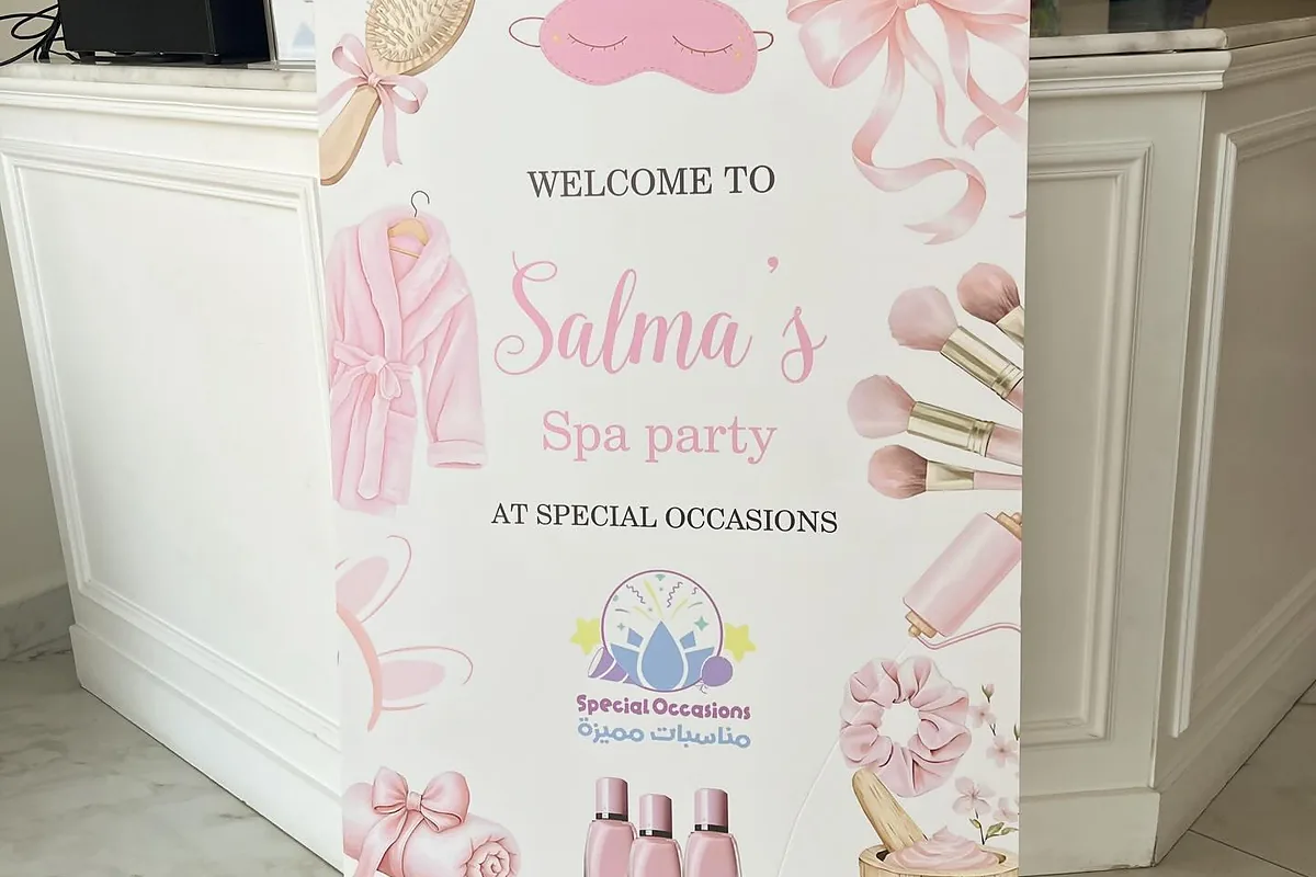 Personalized spa birthday welcome sign displayed on an easel