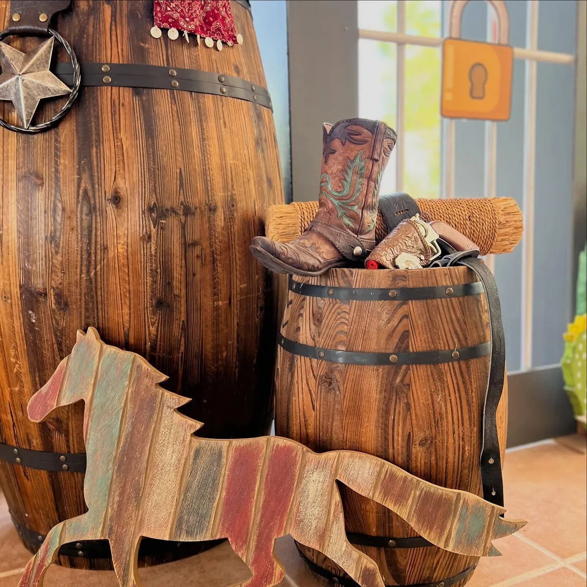 Wooden western barrels, cowboy boots and rustic themed props